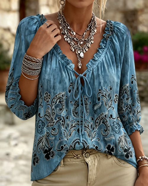 Blusa con cuello redondo, mangas tres cuartos y corbata