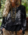 Blusa con estampado botánico y mangas tipo murciélago