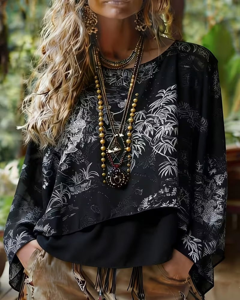Blusa con estampado botánico y mangas tipo murciélago