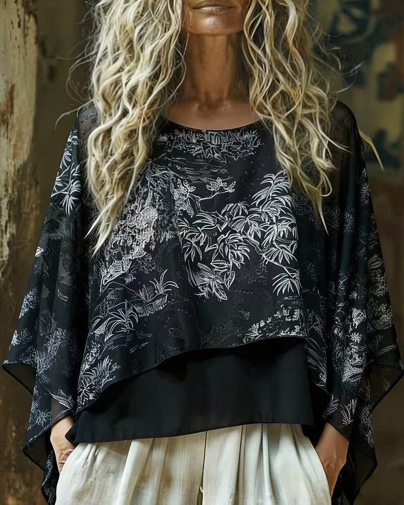 Blusa con estampado botánico y mangas tipo murciélago