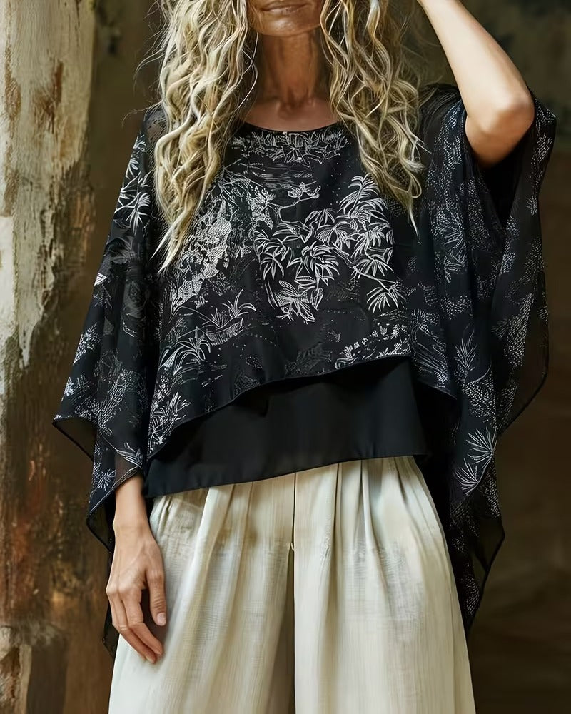 Blusa con estampado botánico y mangas tipo murciélago