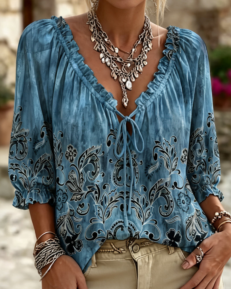 Blusa con cuello redondo, mangas tres cuartos y corbata